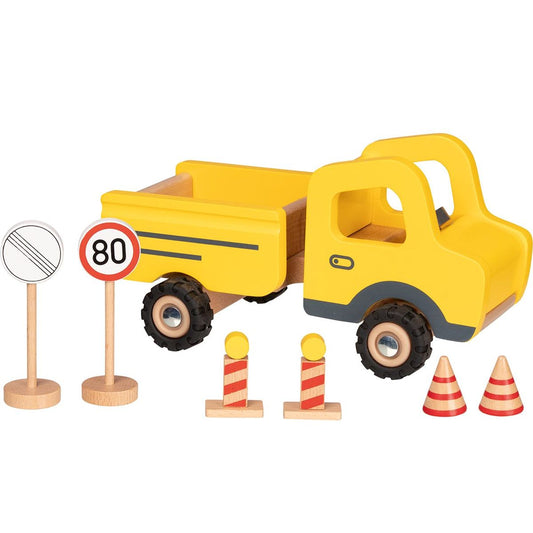 Baustellenfahrzeug mit Verkehrsschildern
