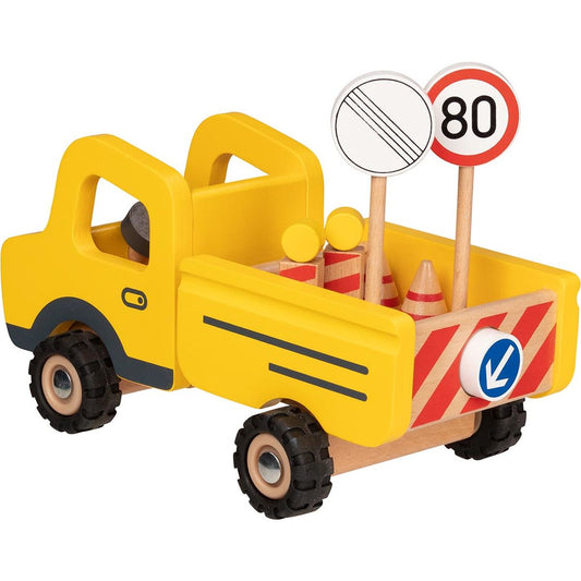 Baustellenfahrzeug mit Verkehrsschildern